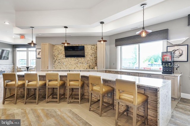 3802 Rock Spring Dr, Upper Marlboro, MD 20772 - bar featuring a raised ceiling, recessed lighting, light wood-style flooring, and decorative light fixtures