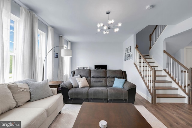 3802 Rock Spring Dr, Upper Marlboro, MD 20772 - living area featuring stairs, baseboards, an inviting chandelier, and wood finished floors