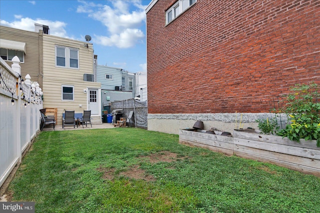 view of yard featuring a patio area and a fenced backyard