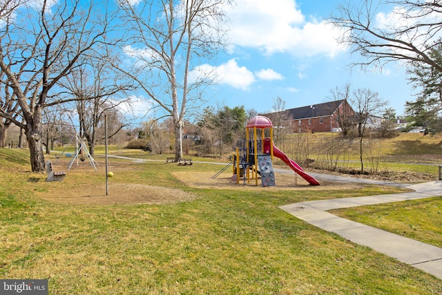 community play area featuring a lawn