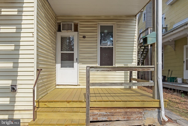 entrance to property featuring a wall mounted AC