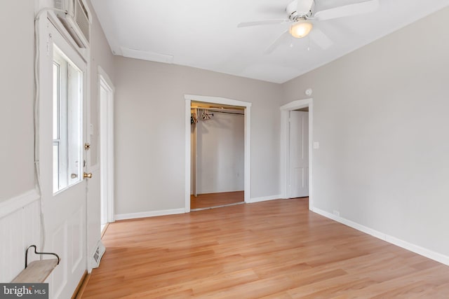 unfurnished bedroom featuring visible vents, baseboards, ceiling fan, a closet, and light wood-type flooring