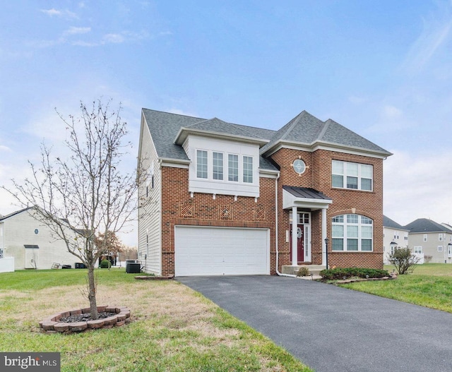 view of front of house with aphalt driveway, brick siding, a front yard, central AC, and a garage