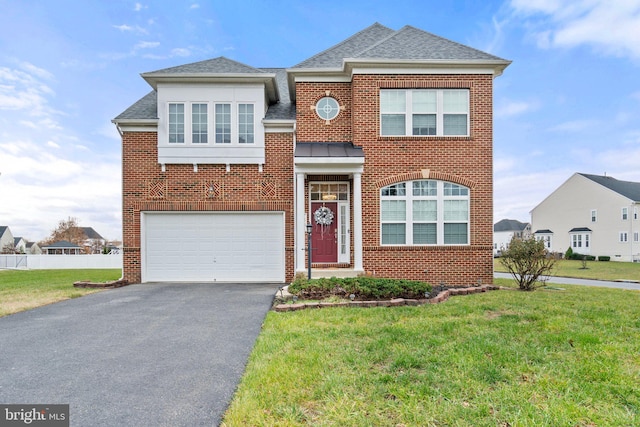 view of front of house featuring brick siding, an attached garage, a shingled roof, and aphalt driveway