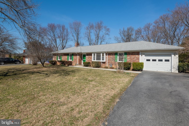 ranch-style house featuring driveway, an attached garage, a chimney, a front lawn, and brick siding