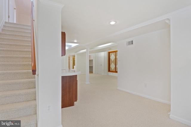 stairs with visible vents, crown molding, baseboards, carpet, and recessed lighting