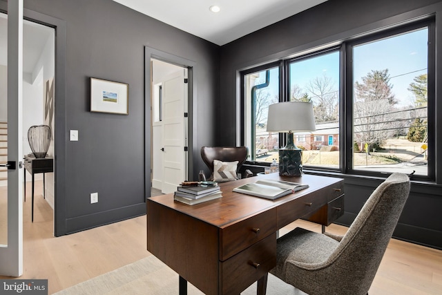 home office with light wood-style floors, recessed lighting, and baseboards