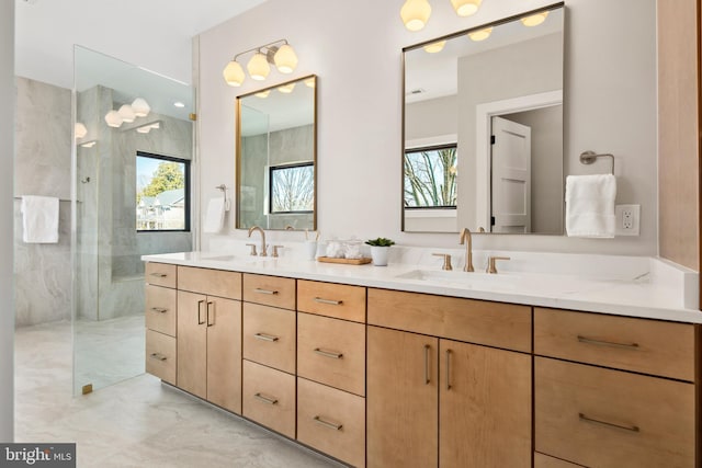 full bath with a walk in shower, a sink, and a wealth of natural light