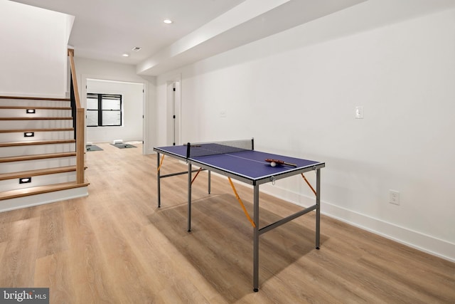 recreation room with light wood-type flooring, baseboards, and recessed lighting