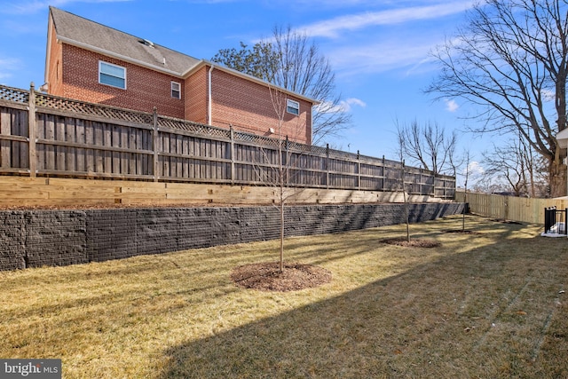 view of yard with a fenced backyard