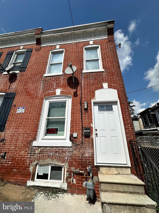 view of front of property featuring brick siding