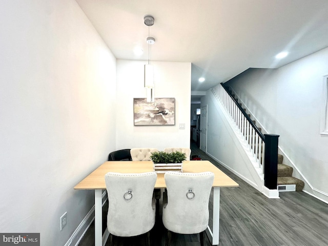 dining space featuring dark wood-style floors, baseboards, stairway, and recessed lighting