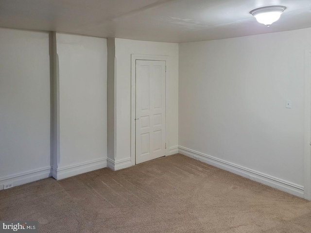 unfurnished bedroom with carpet and baseboards