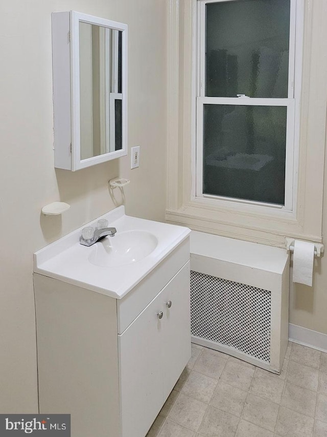 bathroom with vanity and radiator heating unit