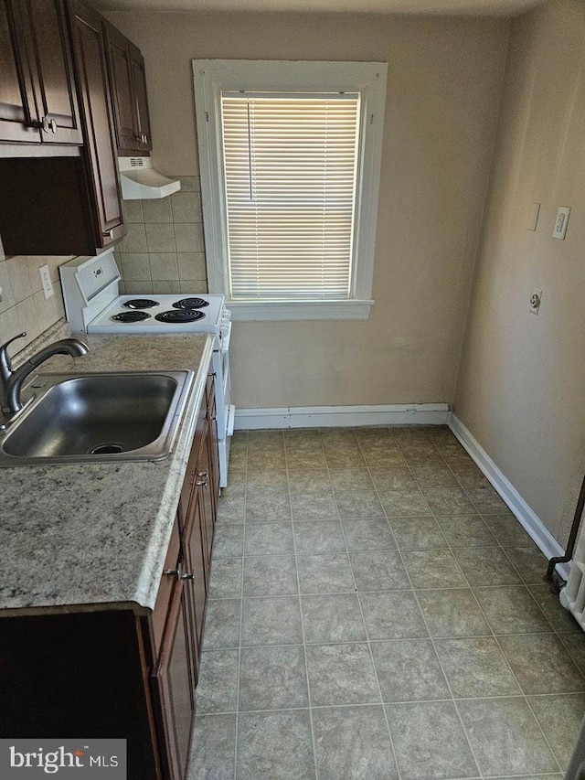 kitchen with white electric stove, decorative backsplash, a sink, baseboards, and extractor fan