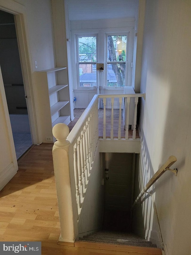 stairs with wood finished floors