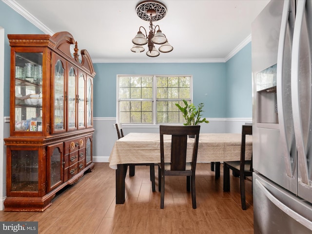 244 Raintree Blvd, Stafford, VA 22556 - dining space with a chandelier, light wood-style floors, baseboards, and crown molding