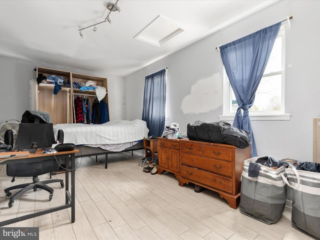 244 Raintree Blvd, Stafford, VA 22556 - bedroom featuring rail lighting, light wood finished floors, a closet, and attic access