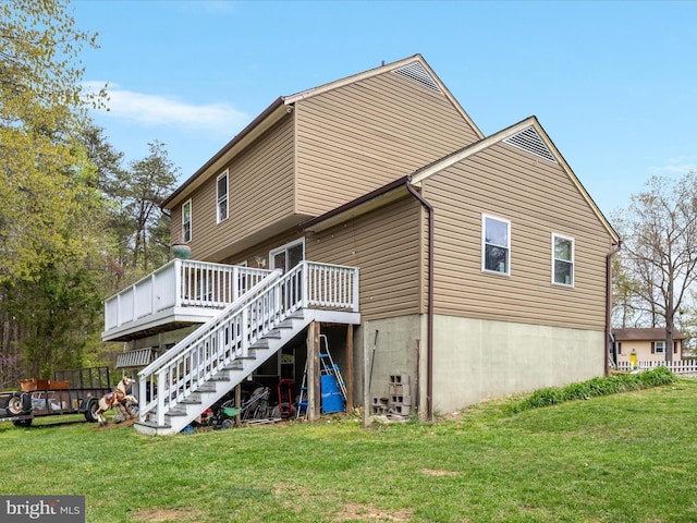 244 Raintree Blvd, Stafford, VA 22556 - back of house featuring a yard, a deck, and stairs