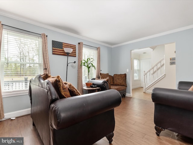 244 Raintree Blvd, Stafford, VA 22556 - living area with crown molding, baseboards, stairway, and light wood-style floors