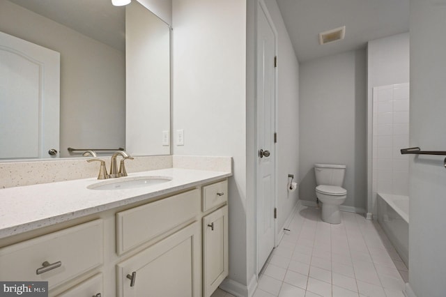 bathroom featuring vanity, visible vents, a bathing tub, tile patterned floors, and toilet