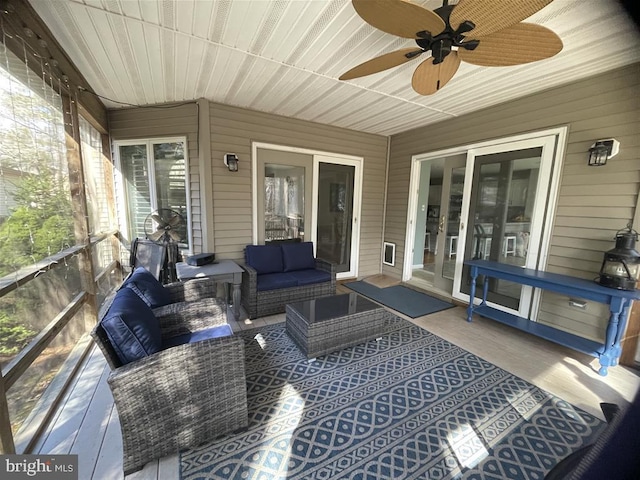 exterior space with ceiling fan