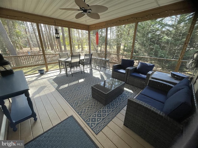 sunroom / solarium with ceiling fan