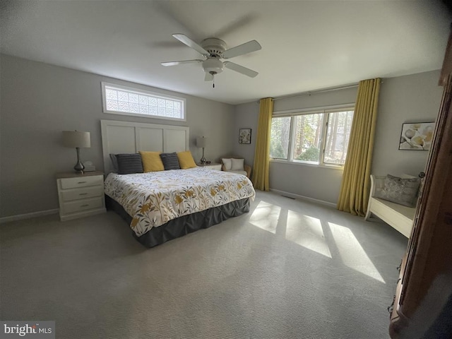 bedroom with carpet, baseboards, and ceiling fan