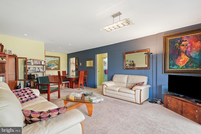 carpeted living room featuring recessed lighting