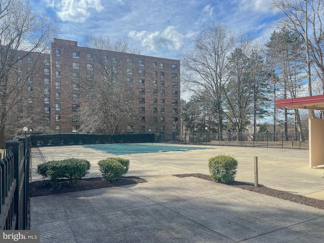 view of pool featuring fence