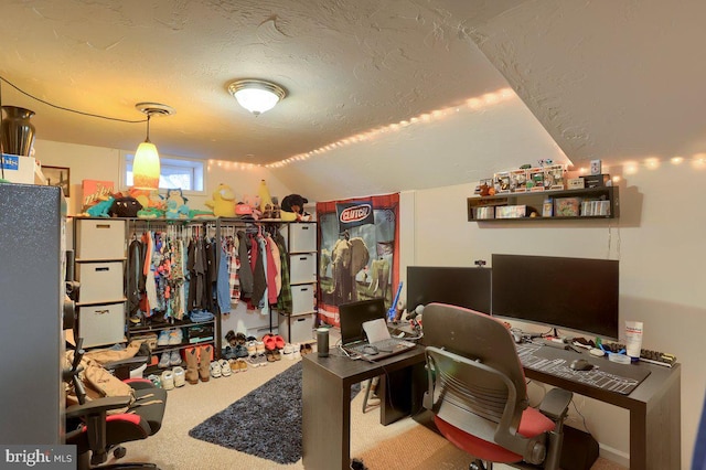 carpeted home office with a textured ceiling and lofted ceiling