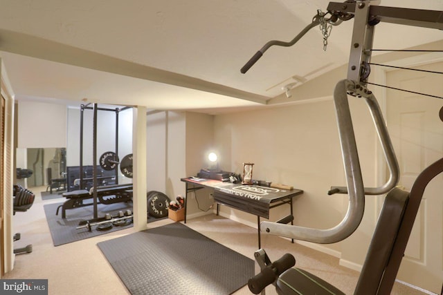 exercise area with carpet floors and baseboards