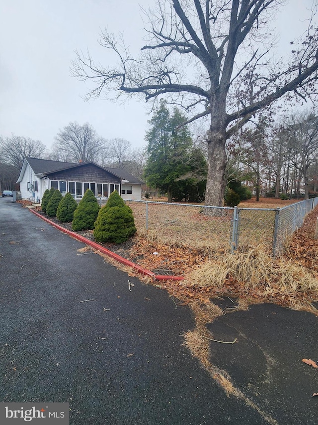 view of front of house featuring fence