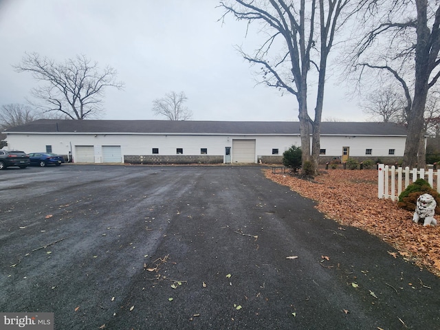 view of front of home featuring fence