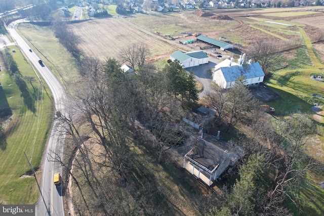 birds eye view of property with a rural view