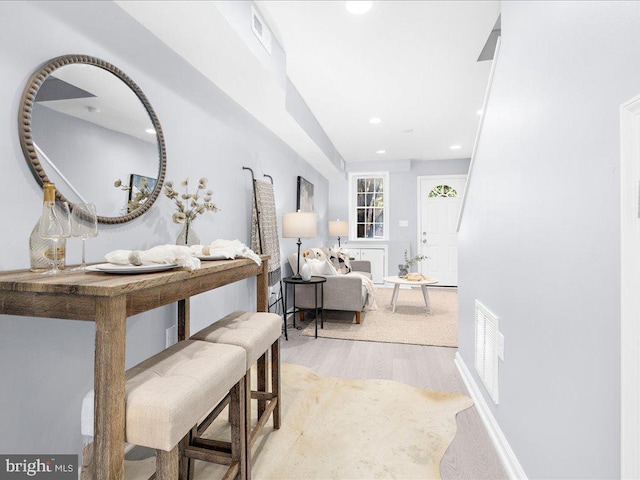 interior space with visible vents, wood finished floors, and recessed lighting