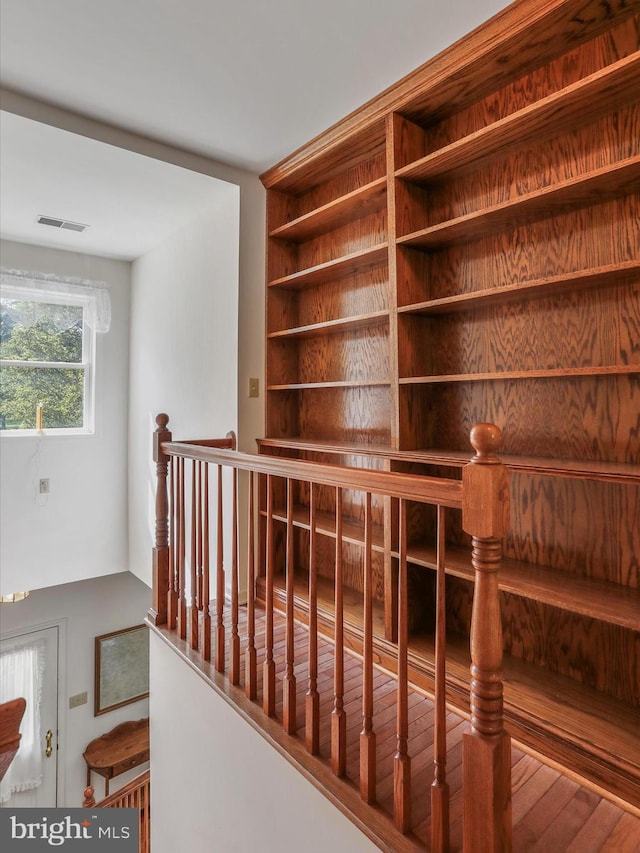 hallway featuring visible vents