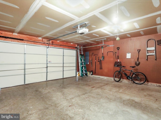 garage with electric panel and a garage door opener