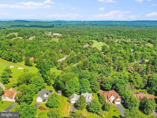 aerial view with a wooded view