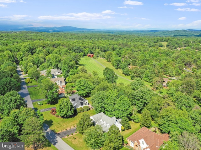 drone / aerial view featuring a forest view