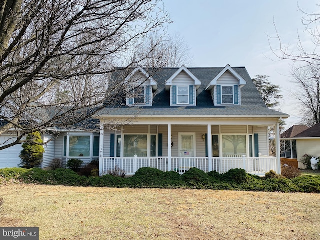 view of front of house featuring a porch and a shingled roof