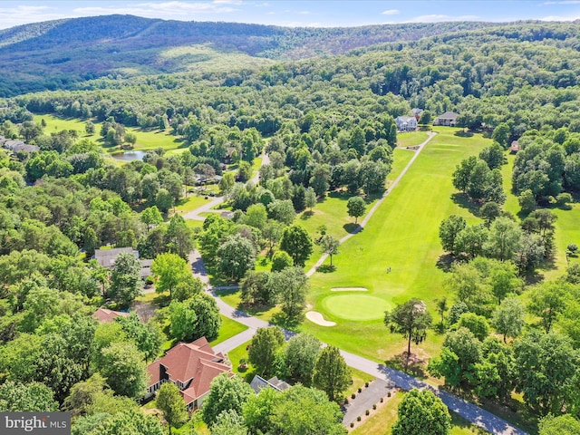 birds eye view of property with a view of trees