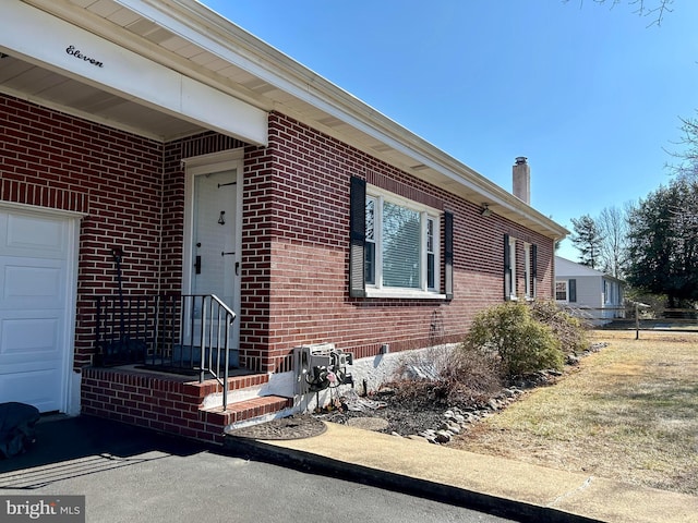 exterior space featuring brick siding