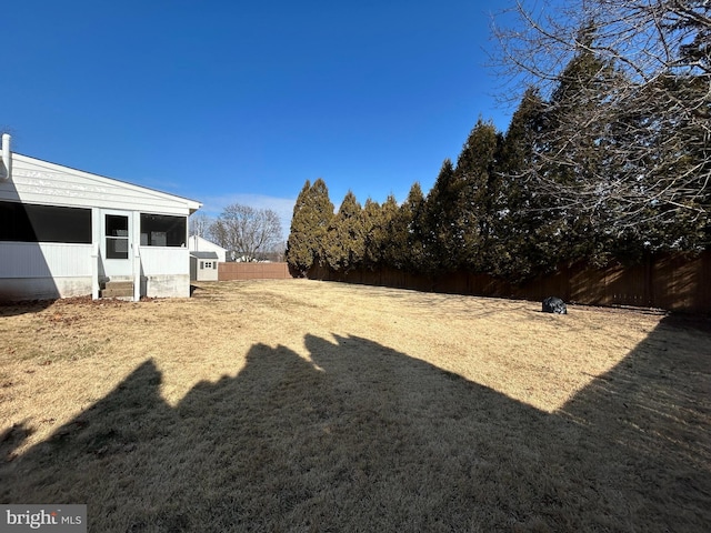 view of yard featuring a fenced backyard