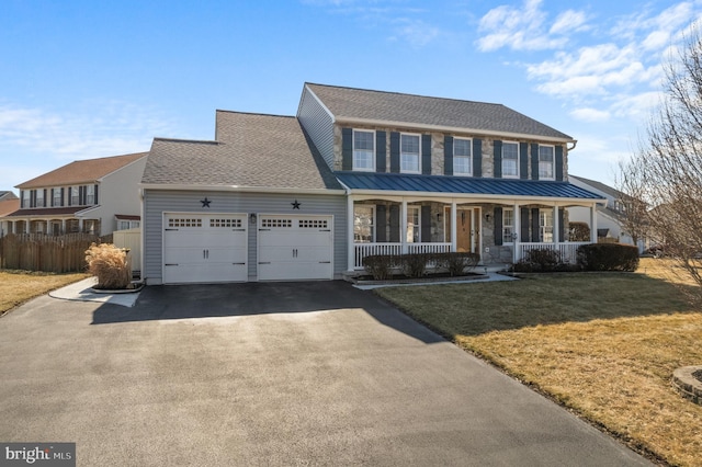 view of front of house featuring a garage, driveway, a porch, roof with shingles, and a front lawn