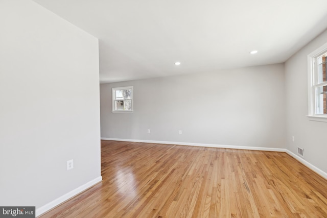 spare room with recessed lighting, visible vents, baseboards, and light wood finished floors