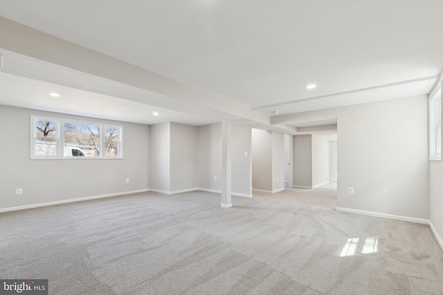 below grade area with recessed lighting, baseboards, and carpet flooring