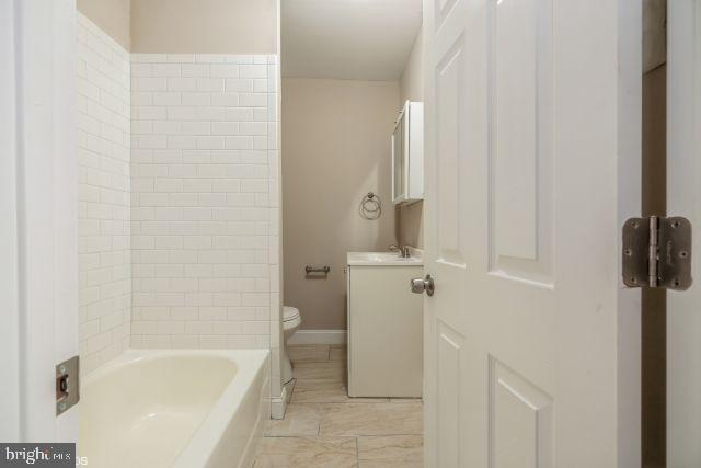 bathroom with toilet and vanity