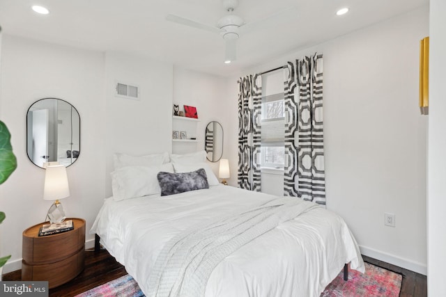 bedroom with baseboards, visible vents, a ceiling fan, wood finished floors, and recessed lighting