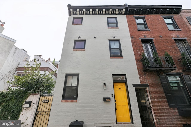 view of front of house with brick siding